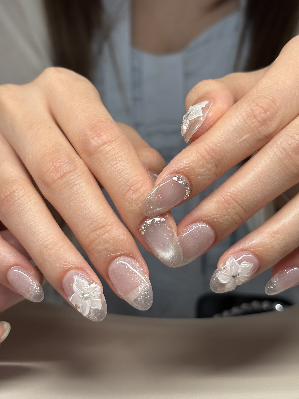 White 3D Blossoms with Glitter and Stones | Delicate Nail Art in Tokyo