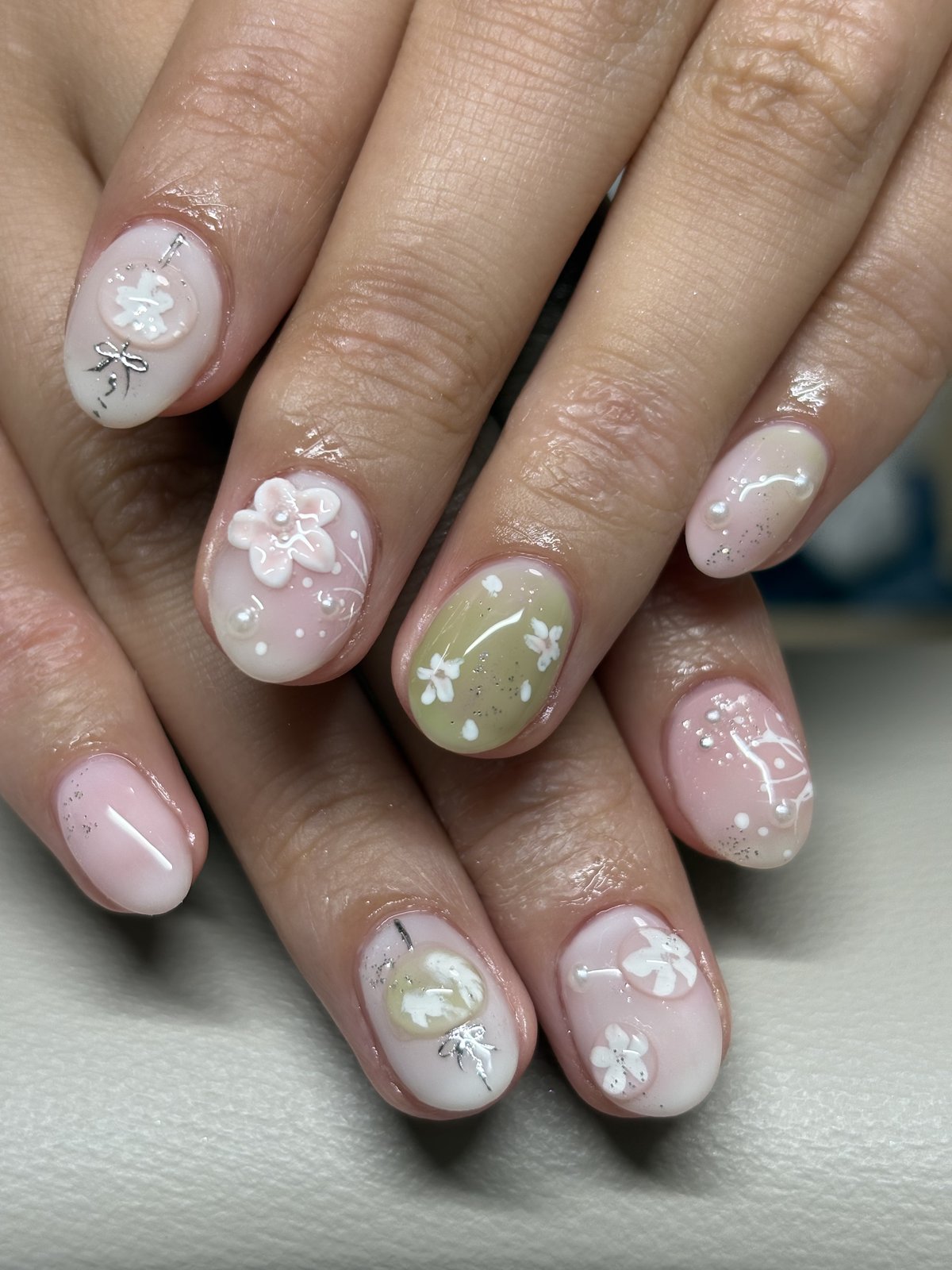 White Blossoms and Silver Line Work on Sheer Pink - nail design by lull., Harajuku Tokyo